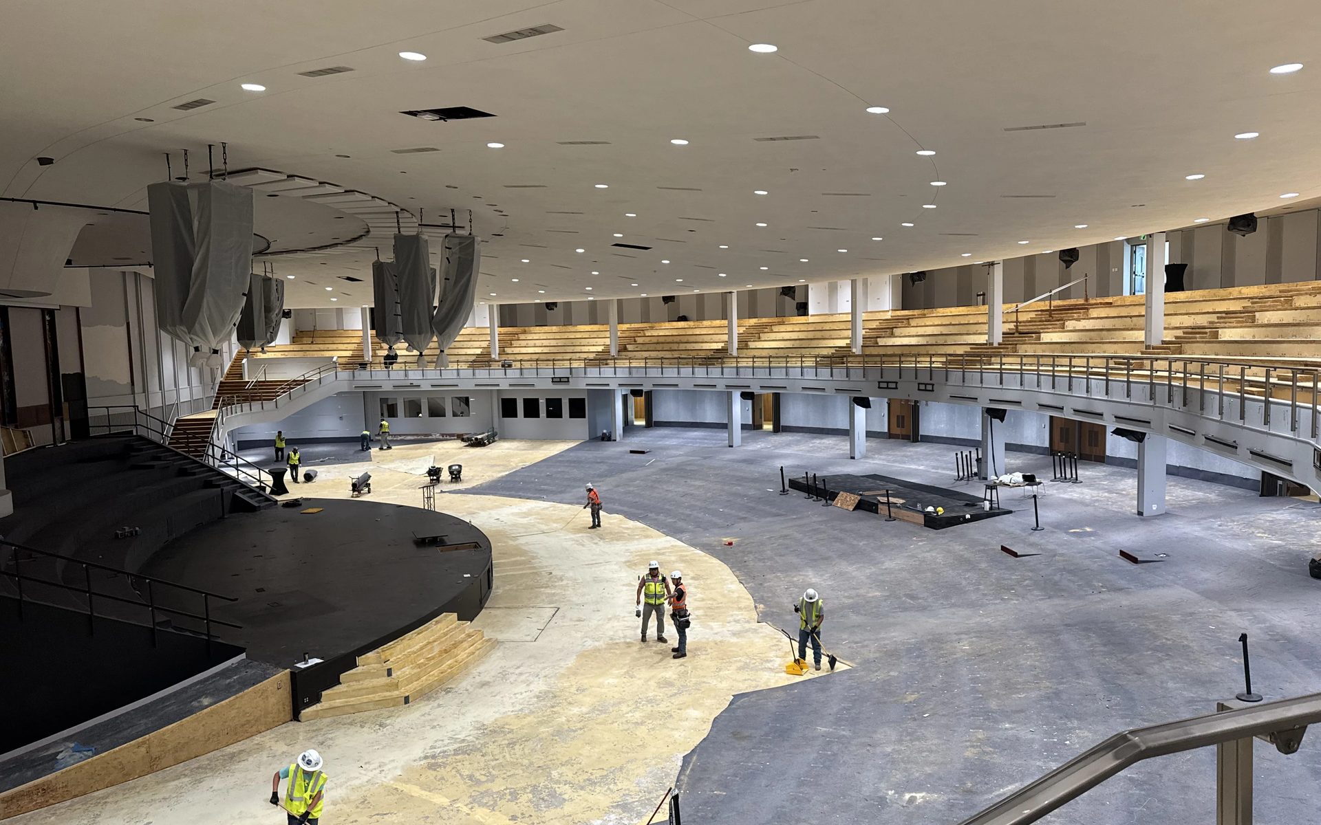 Crews on the floor of the BRAVE Church auditorium during the LED lighting retrofit in Cherry Hills Village, Colorado