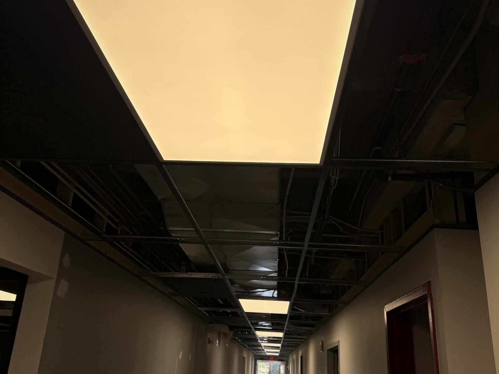 LED flat panels energized in a corridor at BRAVE Church during the lighting retrofit