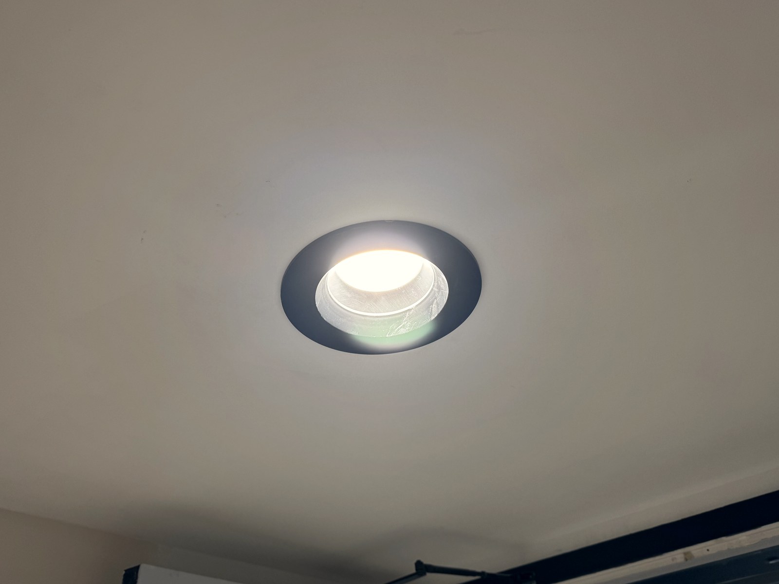 Recessed LED can light trim detail in a commercial ceiling